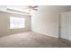 Bright bedroom featuring neutral walls and ceiling fan at 4262 Buford Valley Way, Buford, GA 30518