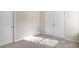 Bedroom with double door closet and neutral walls at 4262 Buford Valley Way, Buford, GA 30518