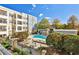 Community pool with surrounding landscaping and building view at 870 Inman Village Ne Pkwy # 317, Atlanta, GA 30307