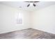 Bright bedroom with wood-look floors and a window providing natural light at 2686 Horseshoe Bend Rd, Marietta, GA 30064