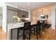 Modern kitchen with granite countertops, stainless steel appliances, and seating at the island at 3630 Peachtree Ne Rd # 2305, Atlanta, GA 30326