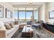 Bright living room featuring city views and sectional sofa at 3630 Peachtree Ne Rd # 2305, Atlanta, GA 30326