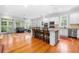 Open kitchen with granite island and hardwood floors at 61 Alden Nw Ave, Atlanta, GA 30309