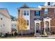 Brick front of charming townhome with covered entry and landscaping at 6008 Park Ave, Roswell, GA 30076