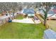 Large, fenced backyard with a patio, green space, and parking area at 1375 Miller Reed Se Ave, Atlanta, GA 30315