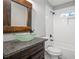 Stylish bathroom with a unique glass bowl sink, rustic mirror, and updated shower at 1375 Miller Reed Se Ave, Atlanta, GA 30315