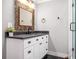 Charming bathroom with a granite vanity, decorative mirror, and a glass-enclosed shower at 1375 Miller Reed Se Ave, Atlanta, GA 30315