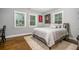 Cozy bedroom with hardwood floors, lots of windows, and a comfortable queen bed at 1375 Miller Reed Se Ave, Atlanta, GA 30315
