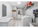 Well-organized laundry room with modern washer, dryer, and ample storage at 1375 Miller Reed Se Ave, Atlanta, GA 30315