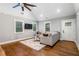 Cozy living room featuring hardwood floors, natural light, and a sectional sofa at 1375 Miller Reed Se Ave, Atlanta, GA 30315