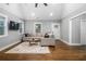 Bright living room with a neutral color scheme, hardwood flooring, and a comfortable seating arrangement at 1375 Miller Reed Se Ave, Atlanta, GA 30315