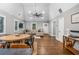 Open-concept living room with hardwood floors, neutral paint, and a vaulted ceiling with a fan at 1375 Miller Reed Se Ave, Atlanta, GA 30315