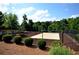 Sandy volleyball court surrounded by trees, for recreation and outdoor fun at 1379 Christiana Dr, Lawrenceville, GA 30043