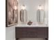 Stylish bathroom with double vanity, modern light fixtures, and decorative accents at 3488 Tuxedo Nw Rd, Atlanta, GA 30305