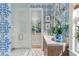 Elegant bathroom with blue wallpaper, modern vanity, and glass enclosed shower at 3488 Tuxedo Nw Rd, Atlanta, GA 30305