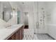 Modern bathroom featuring a glass shower, double sink vanity, and geometric tile flooring at 3488 Tuxedo Nw Rd, Atlanta, GA 30305