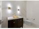 Modern bathroom featuring marble accent wall, and gold fixtures at 3488 Tuxedo Nw Rd, Atlanta, GA 30305