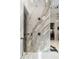 A luxurious bathroom highlighting a glass shower with marble walls, and modern fixtures at 3488 Tuxedo Nw Rd, Atlanta, GA 30305