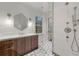 Modern bathroom featuring a glass-enclosed shower, stylish lighting, and elegant tile flooring at 3488 Tuxedo Nw Rd, Atlanta, GA 30305