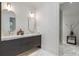 Bathroom features a double vanity, decorative lighting, and glass-enclosed shower at 3488 Tuxedo Nw Rd, Atlanta, GA 30305
