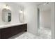 Bathroom features a double vanity, decorative lighting, and glass-enclosed shower at 3488 Tuxedo Nw Rd, Atlanta, GA 30305