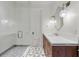 Well-lit bathroom showcasing a glass shower and modern vanity with a unique mirror at 3488 Tuxedo Nw Rd, Atlanta, GA 30305