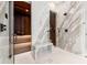 Elegant bathroom featuring a sauna, marble walls, glass shower, marble bench, and sleek fixtures at 3488 Tuxedo Nw Rd, Atlanta, GA 30305