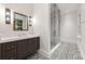 Modern bathroom with sleek vanity, elegant mirror, and frameless glass shower at 3488 Tuxedo Nw Rd, Atlanta, GA 30305