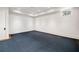 Empty bedroom with blue carpeting, a window with a view, and a white paint scheme at 3488 Tuxedo Nw Rd, Atlanta, GA 30305