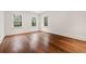 Bright, airy bedroom with hardwood floors and three large windows offering ample natural light at 3488 Tuxedo Nw Rd, Atlanta, GA 30305