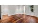 Bedroom boasts hardwood floors, and an open entrance to an ensuite bath at 3488 Tuxedo Nw Rd, Atlanta, GA 30305