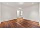 Bedroom with hardwood floors, white walls, and ensuite access at 3488 Tuxedo Nw Rd, Atlanta, GA 30305