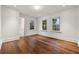 Bedroom with hardwood floors and three bright windows at 3488 Tuxedo Nw Rd, Atlanta, GA 30305