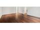 Spacious bedroom showcasing beautiful hardwood floors, neutral walls, and natural light from open doorways at 3488 Tuxedo Nw Rd, Atlanta, GA 30305