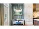 Charming breakfast nook with natural light, elegant chandelier, and custom cabinetry at 3488 Tuxedo Nw Rd, Atlanta, GA 30305
