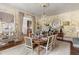 Refined dining room showcasing hardwood floors, classic wallpaper, and a stylish chandelier at 3488 Tuxedo Nw Rd, Atlanta, GA 30305