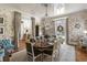 An elegant dining room with botanical wallpaper, crystal chandelier, and seating for eight at 3488 Tuxedo Nw Rd, Atlanta, GA 30305