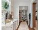 Well-lit dressing room with make-up vanity, natural light and display shelving at 3488 Tuxedo Nw Rd, Atlanta, GA 30305