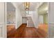 Grand foyer with hardwood floors, elegant staircase, and access to multiple living spaces at 3488 Tuxedo Nw Rd, Atlanta, GA 30305