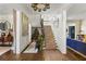 Spacious foyer features stairway decorated for Christmas, with hardwood flooring, and elegant decor at 3488 Tuxedo Nw Rd, Atlanta, GA 30305