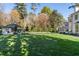 Well-manicured front yard features a grand home, lush lawn, and detailed landscaping at 3488 Tuxedo Nw Rd, Atlanta, GA 30305