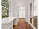 Hallway desk and storage, with gleaming wood floors and natural light at 3488 Tuxedo Nw Rd, Atlanta, GA 30305