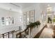 Bright hallway with wood floors and custom botanical gallery wall at 3488 Tuxedo Nw Rd, Atlanta, GA 30305