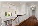 Hallway with hardwood floors, bright windows, and decorative chandelier at 3488 Tuxedo Nw Rd, Atlanta, GA 30305