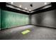 Home theater featuring soundproofing wall coverings, projector and black carpet at 3488 Tuxedo Nw Rd, Atlanta, GA 30305
