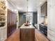 Spacious kitchen with a large island, custom cabinets, designer lighting, and access to the patio at 3488 Tuxedo Nw Rd, Atlanta, GA 30305