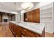 Close up kitchen island featuring marble countertops, hardwood floors, and custom cabinetry at 3488 Tuxedo Nw Rd, Atlanta, GA 30305
