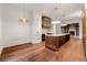 Open kitchen with stone countertops, stainless appliances, hardwood floors, and modern lighting at 3488 Tuxedo Nw Rd, Atlanta, GA 30305