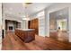 Open kitchen design with a large island featuring marble countertops and hardwood floors at 3488 Tuxedo Nw Rd, Atlanta, GA 30305