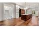 Open kitchen design featuring a large island with hardwood floors, and modern lighting at 3488 Tuxedo Nw Rd, Atlanta, GA 30305